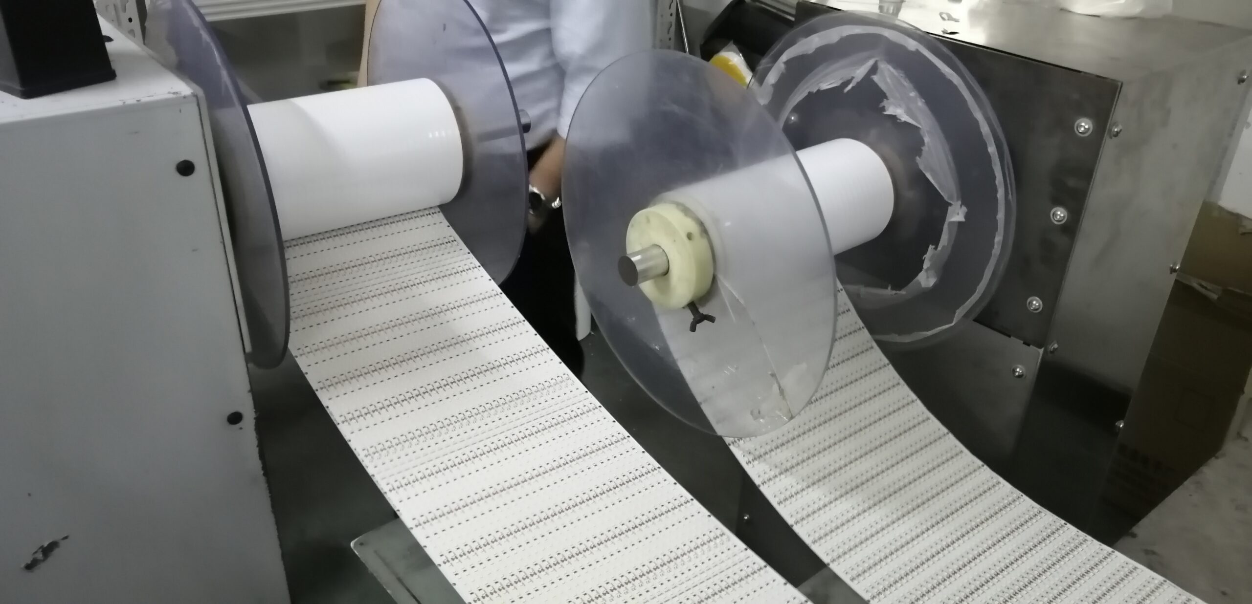 Continuous machine processing: Slitting and re-reeling large flexible PCB panels into finished LED strip rolls for high-volume production.