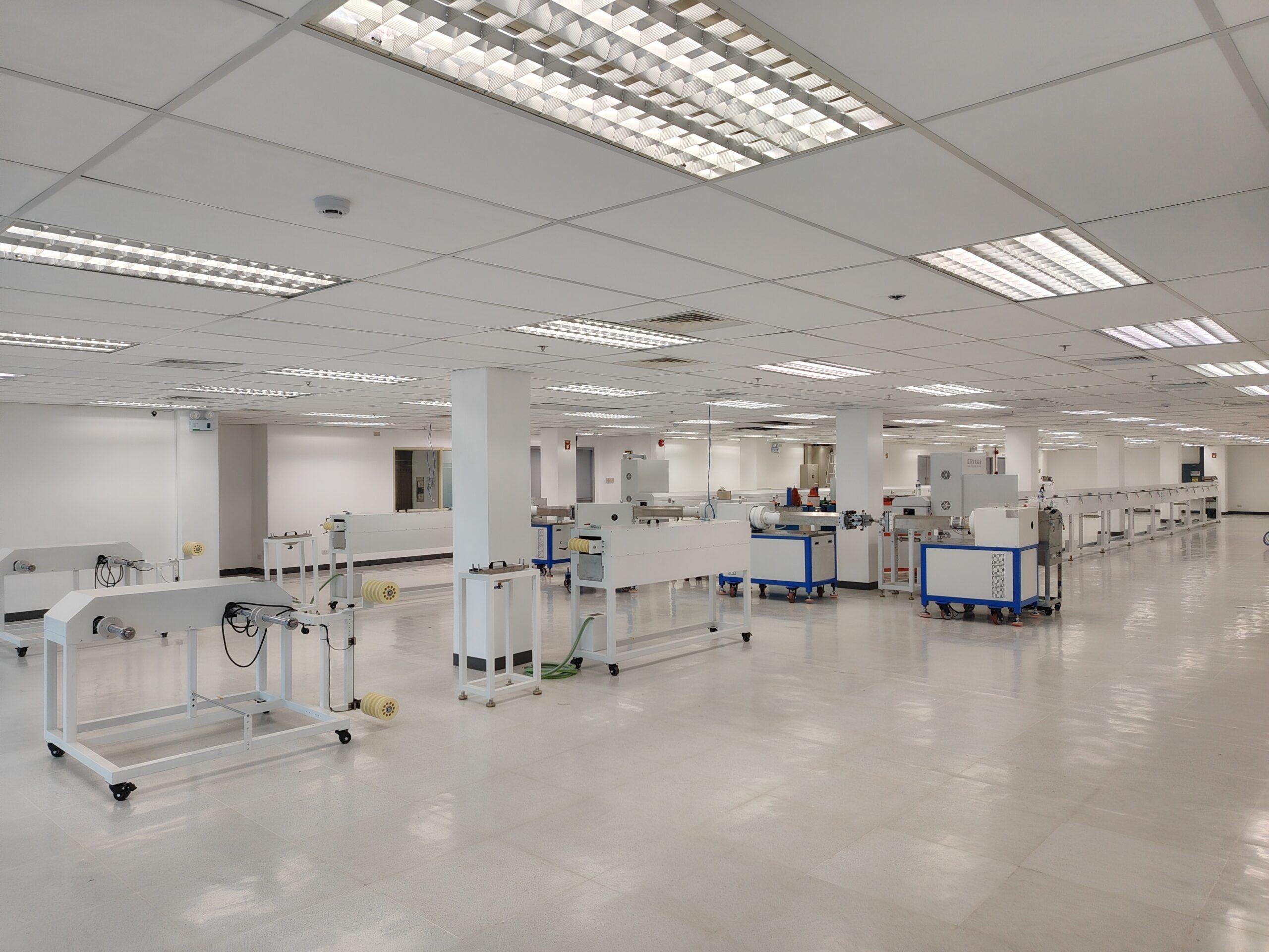 Newly renovated and brightly lit workshop showcasing the newly installed silicone LED strip production line machinery.