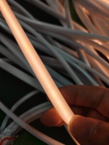 Close-up demonstration of seamless, dot-free illumination from a flexible Micro LED neon strip in low-light conditions.